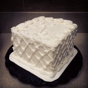 all white monogrammed "K" birthday cake